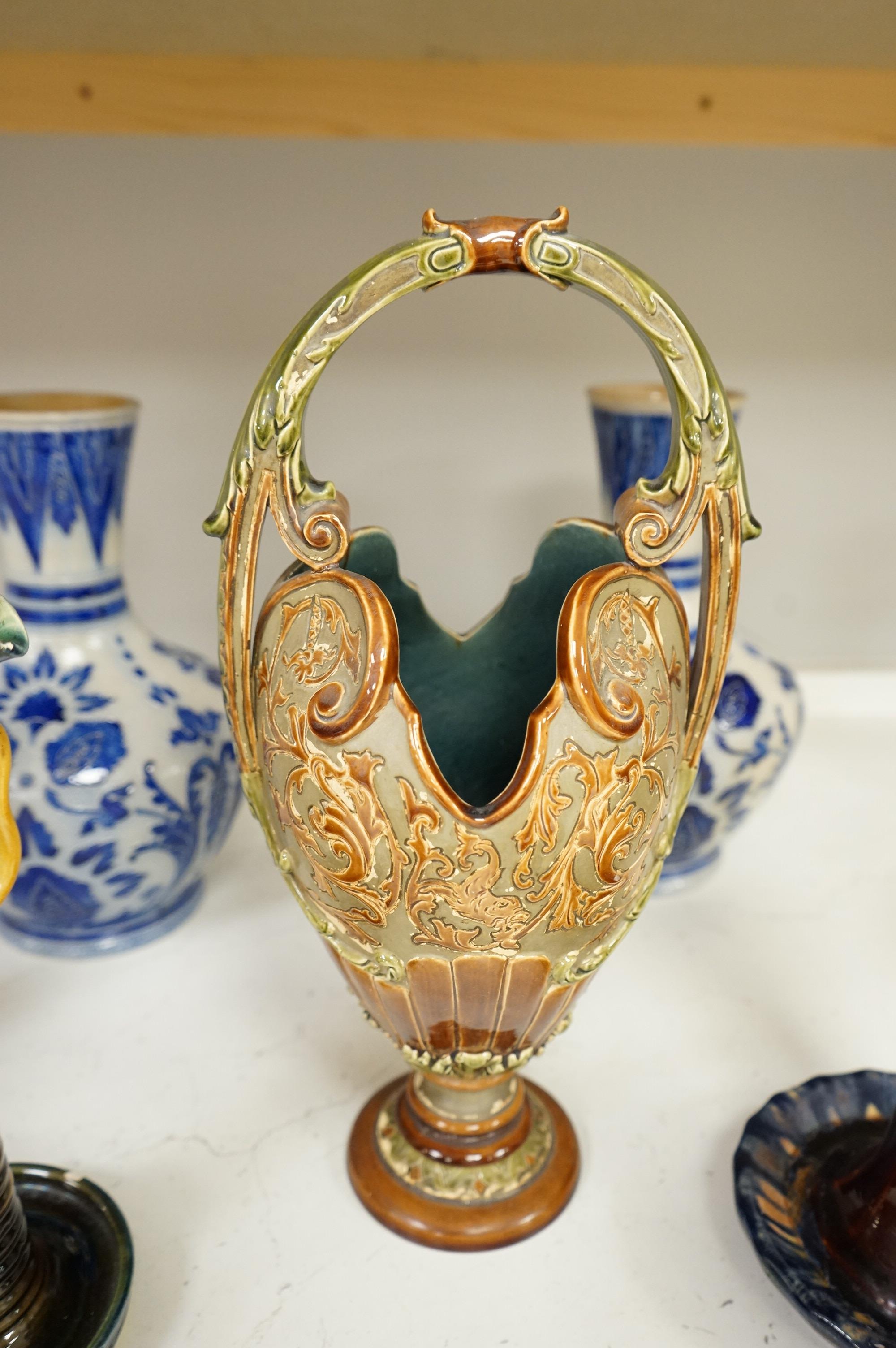 A collection of late 19th century and early 20th century European pottery and stoneware items to include a pair of glazed candlesticks stamped Belgium, largest 36cm high